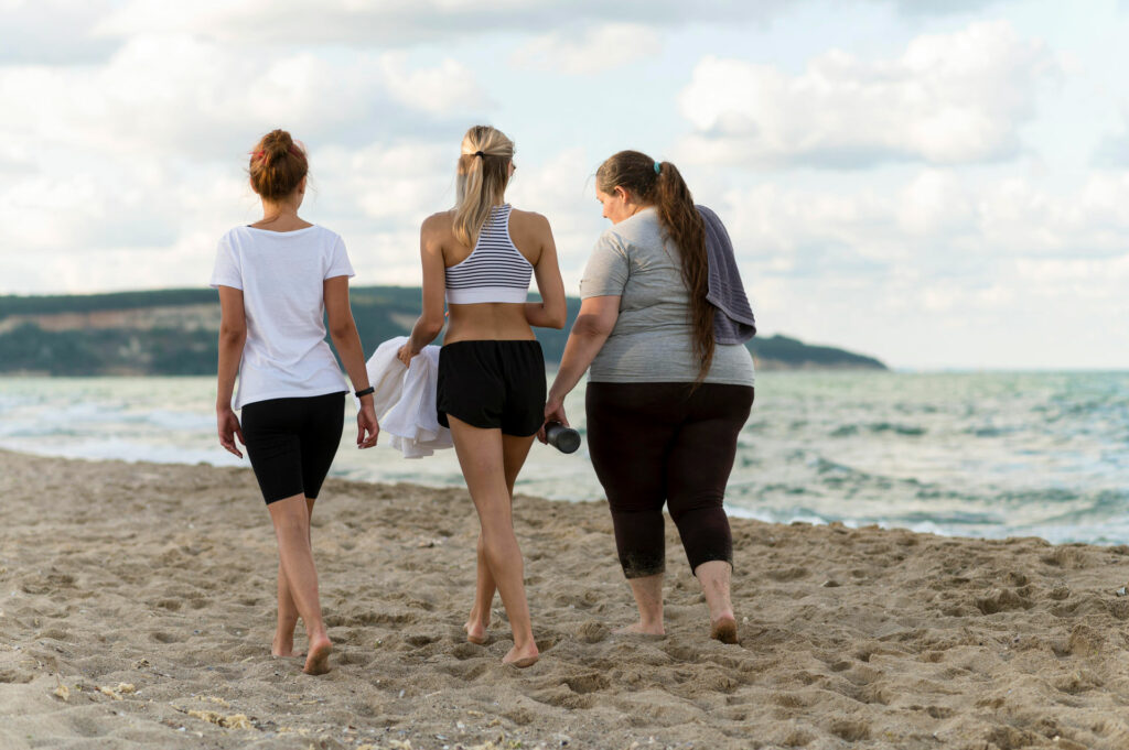 woman walking down the beach