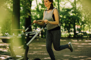 Woman running with her baby in a pram